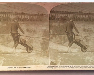 Clifford Calverley pushes a wheelbarrow across the wire.