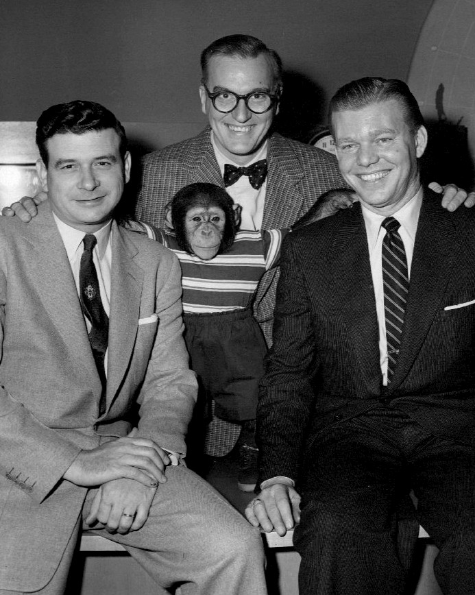 Photo of Frank Blair, Dave Garroway, J. Fred Muggs and Jack Lescoulie from the television program Today. The photo was issued to mark the beginning of the program's second year on the air. By NBC Television, via Wikimedia Commons.
