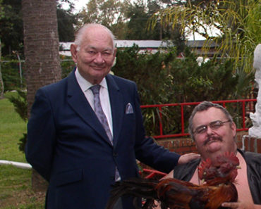 At Ward Hall's house in Gibtown. From left to right: Ward, Bruce Snowdon holding a two-headed chicken, little Pete Terhurne, and me. December, 2003.