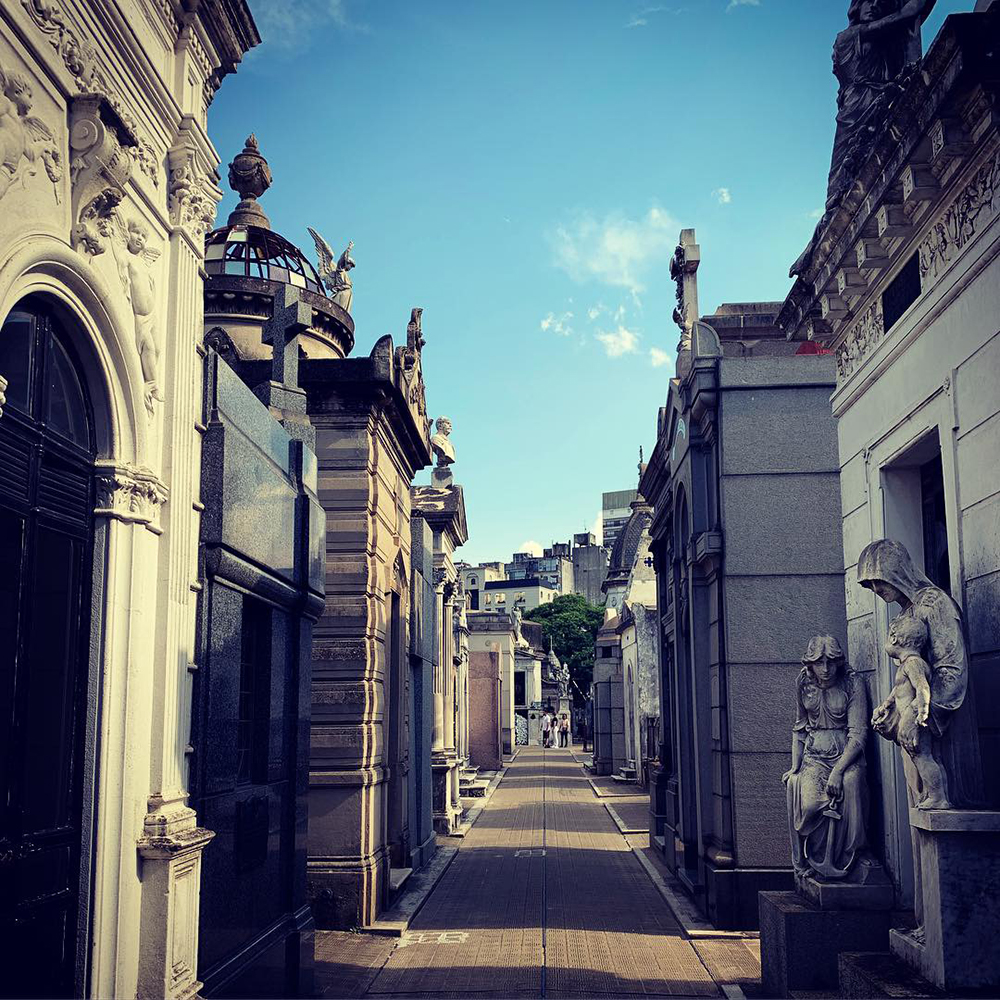 A street lined with mausoleums at Cemeterio de la Recoleta. Photo by Marc Hartzman.
