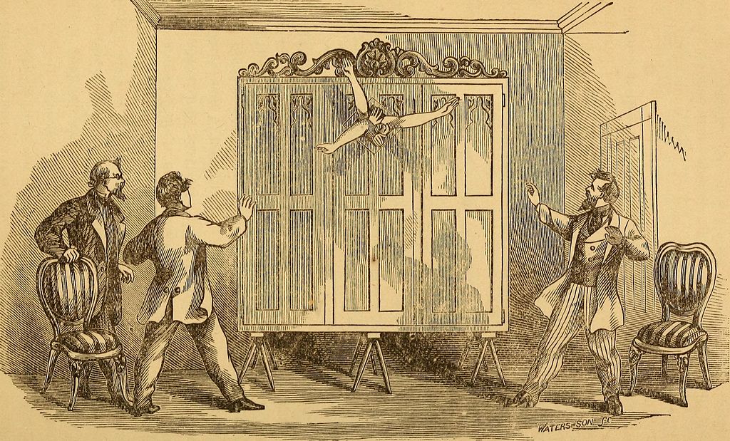 "Spirit" hands reach outside the Davenport cabinet, 1869.